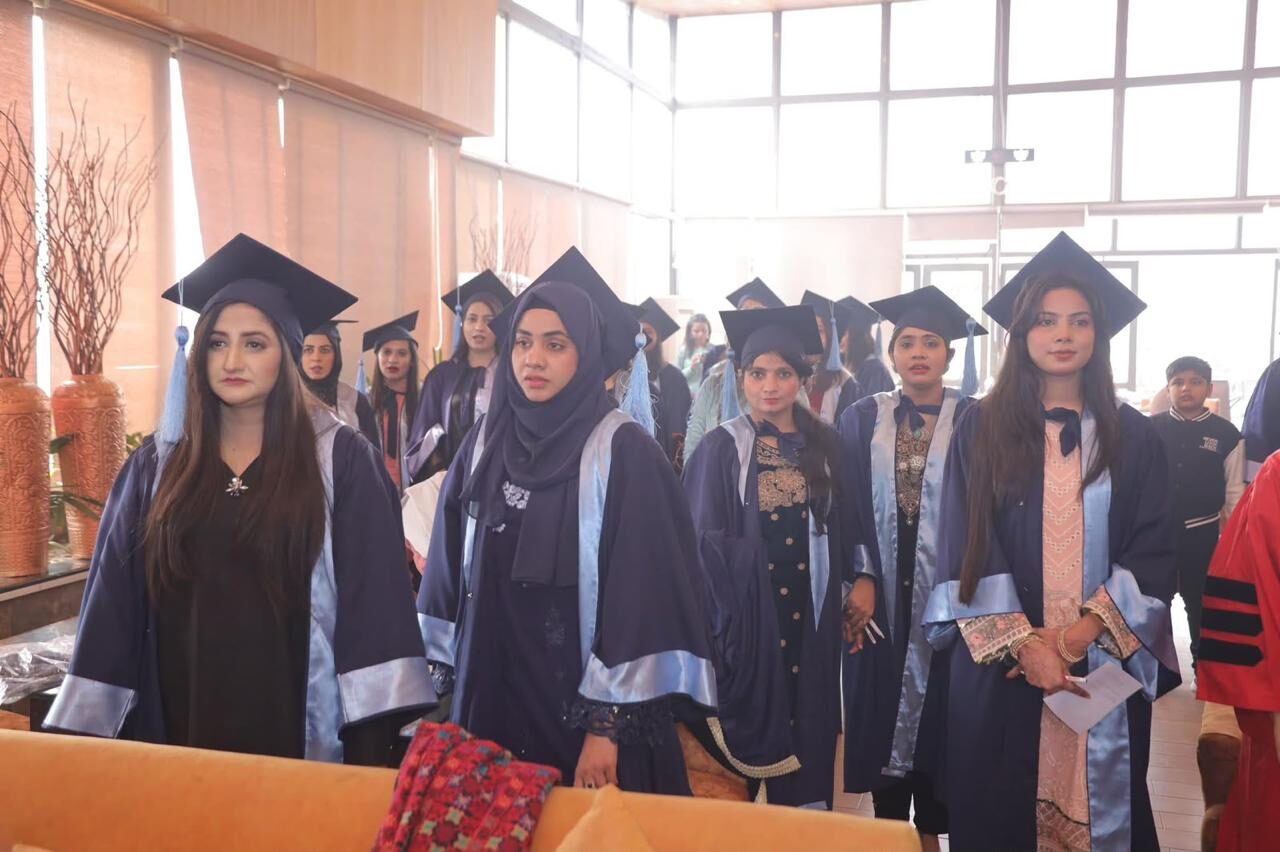 NACON graduates in caps and gowns lined up before the convocation ceremony